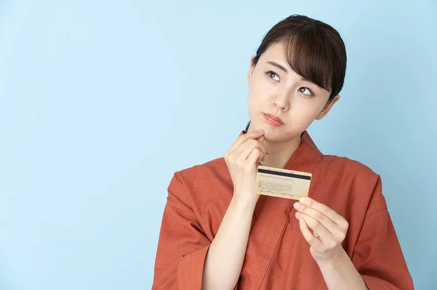 portrait of japanese style waitress isolated on blue background