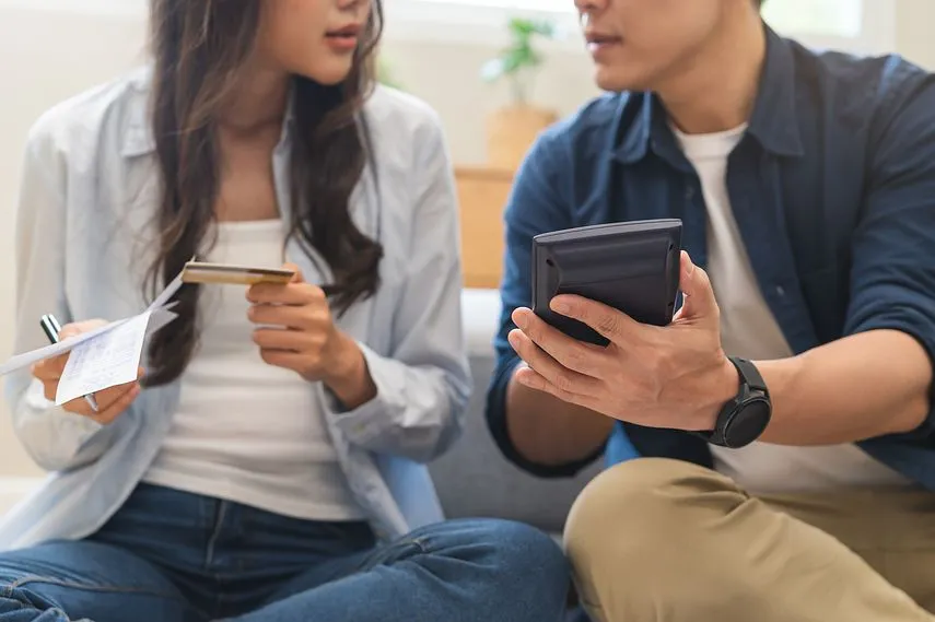 Stressed financial owe asian young couple love sitting suffer, stressed and confused by calculate expense from credit card bill, no money to pay, mortgage or loan. Debt, bankrupt or bankruptcy people.