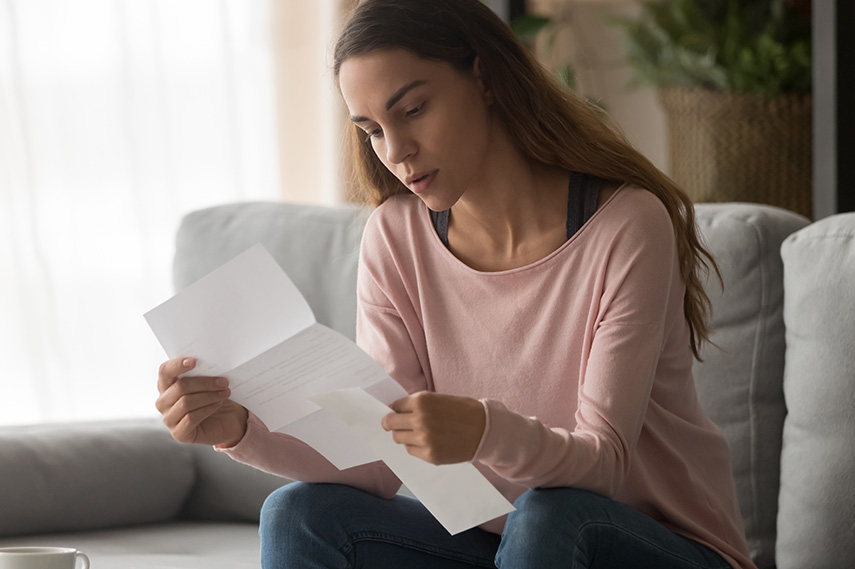 A woman is checking financial documents